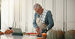 Mature man, tablet or cutting on kitchen counter, ingredient preparation or video tutorial for dinner. Online recipe, blog post or person chop vegetables for healthy food, tech or cooking instruction