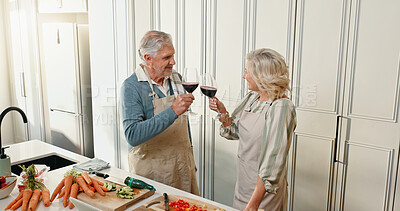 Buy stock photo Cooking, red wine and toast with old couple in home together for anniversary or celebration. Alcohol, cheers and food with senior people in apartment for health, nutrition or wellness from above
