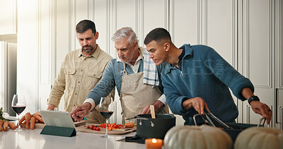 Buy stock photo People, cooking and check tablet in kitchen, prepare ingredients and watch video for food tutorial. Online recipe, family bonding or group of men reading with tech, pointing or meal instruction steps
