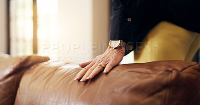 Buy stock photo Hand, couch and person in lounge, furniture and textile with display, material and comfort. Closeup, apartment and homeowner with leather sofa, property and inspection with vacation rental or texture