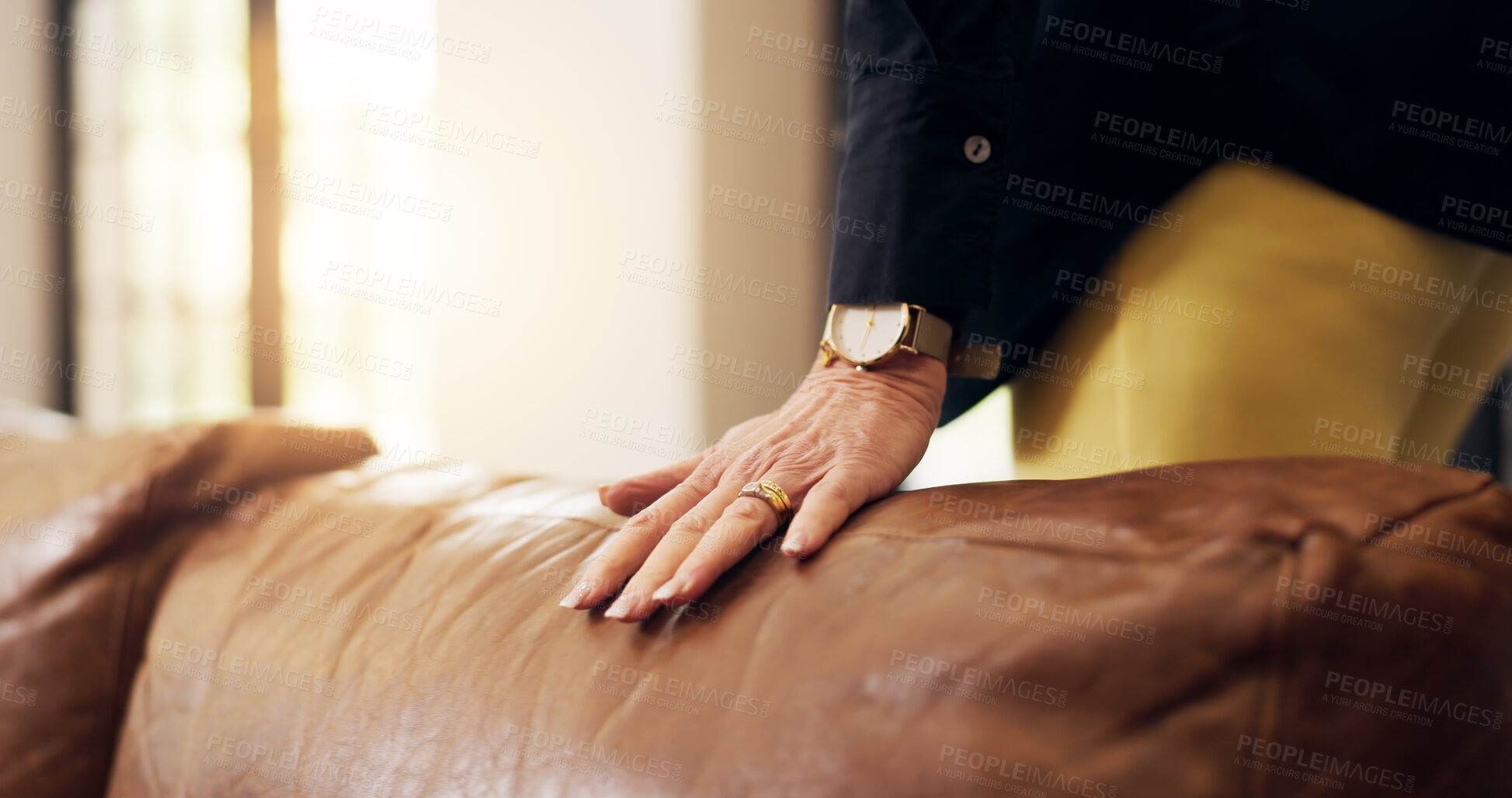 Buy stock photo Hand, couch and person in lounge, furniture and textile with display, material and comfort. Closeup, apartment and homeowner with leather sofa, property and inspection with vacation rental or texture
