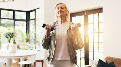 Buy stock photo Senior woman, fitness and dumbbells in home with weightlifting, strength training and routine. Elderly person, exercise and strong with muscle development, workout and flare in retirement at house