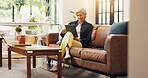 Senior woman, tablet and smile on sofa with scroll, notification or reading ebook in lounge at home. Elderly person, tech and relax with application, flare and video on social media in retirement