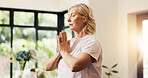 Woman, prayer hands or yoga in home with breathwork for meditation, spiritual healing or wellness. Zen, mature female person or breathe in house with mudra for mindfulness, holistic health or namaste