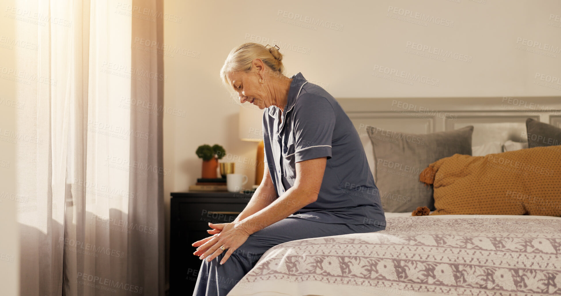 Buy stock photo Home, knee pain and old woman in bedroom, wake up and inflammation with joint injury. Apartment, pensioner and mature person with muscle tension, massage and body care with arthritis or osteoporosis