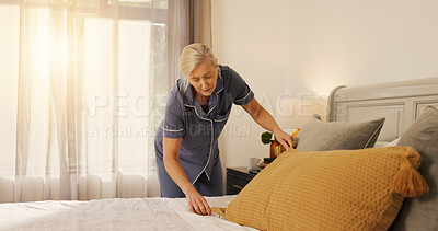Buy stock photo Travel, making bed or woman in hotel with maintenance, tidy or morning routine on weekend getaway. Hospitality, cleaning and tourist in resort with pillow, arranging or getting ready on Saturday trip