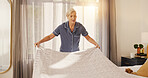 Mature woman, making and bed at house to start day, change bedding and household chores. Female person, sheets and tidy bedroom for hygiene, blanket maintenance and organizing duvet for housekeeping