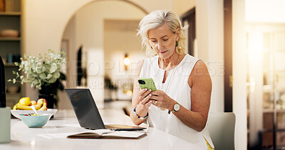 Buy stock photo Woman, laptop and typing in home with phone for social media, text message or online conversation. Mature person, reading and scroll with tech for mobile app notification, communication and internet.