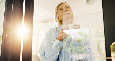 Buy stock photo Coffee, old woman and thinking at window in home for nostalgic memory, remember or daydreaming. Retirement, senior person and beverage with ideas in house for morning inspiration, flare and low angle