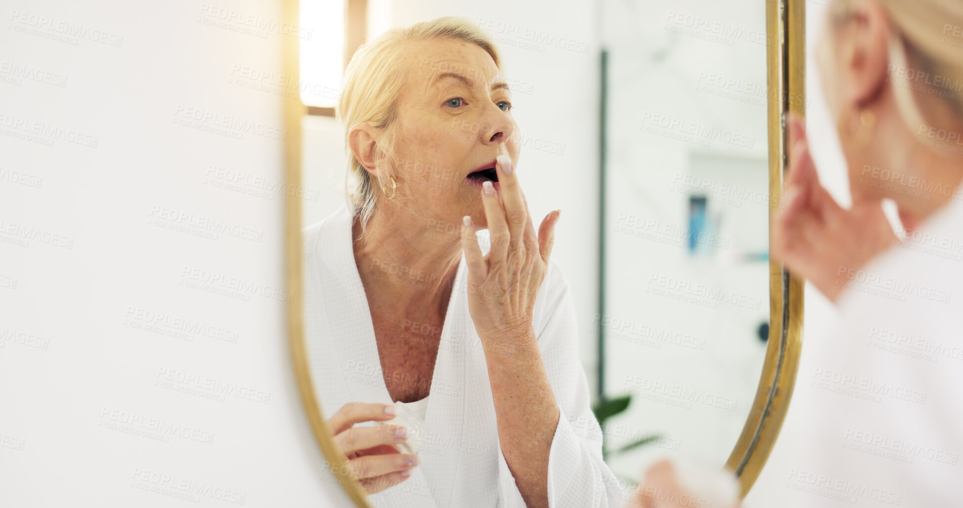 Buy stock photo Home, mirror or old woman in bathroom, skincare or dermatology with lip balm. Reflection, pensioner or senior person with shine, glow or healthy skin with aesthetic, routine or treatment with beauty