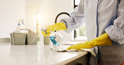 Buy stock photo Person, hands and cleaning with spray bottle on kitchen counter for hygiene or chores in home. Closeup, detergent or gloves with liquid chemical or cleaner for dirt, bacteria or germ removal in house