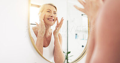 Buy stock photo Mature woman, beauty cream and bathroom mirror for hydration, moisturizer or happy with skincare in home. Female person, reflection and smile for anti aging benefit, dermatology or lotion in house