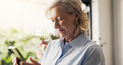 Buy stock photo Smile, phone and senior woman in home for reading news, download game or social media. Happy, elderly person and mobile for communication, online bingo or browsing website in house in retirement