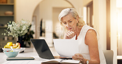 Buy stock photo Woman, laptop and remote work from home, documents and editing report for deadline in kitchen. Mature person, freelance writer and computer for project management, flare and story on web at apartment