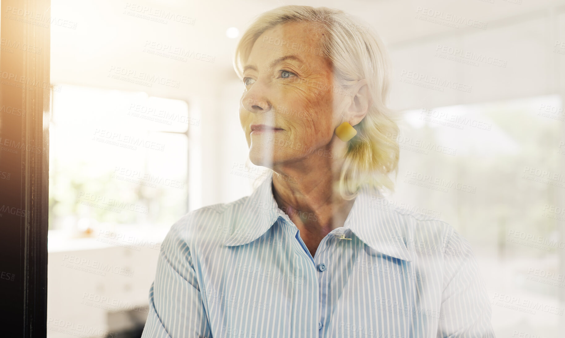 Buy stock photo Senior, woman and thinking with window for reflection, ambition or nostalgia in home. Elderly, female person or thoughtful with dream, idea or reminisce for perception, insight or vision in house