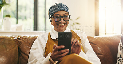 Buy stock photo Happy, home and senior woman with phone for communication, online connection and internet chat. Retirement, morning and person on smartphone on sofa for message, contact and networking on mobile app
