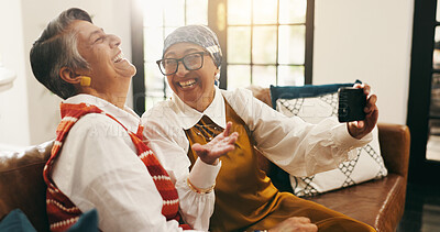 Buy stock photo Selfie, laugh and senior women on sofa for memory together on weekend with bonding in home. Happy, connection and elderly female people with photography picture for friendship in living room at house