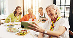 Mature, happy women and dining table with selfie for feast, meal or social gathering in home. Group, female person or friends with smile, food or drinks for photography, picture or memory together