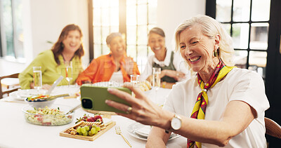 Buy stock photo Mature, happy women and dining table with selfie for feast, meal or social gathering in home. Group, female person or friends with smile, food or drinks for photography, picture or memory together