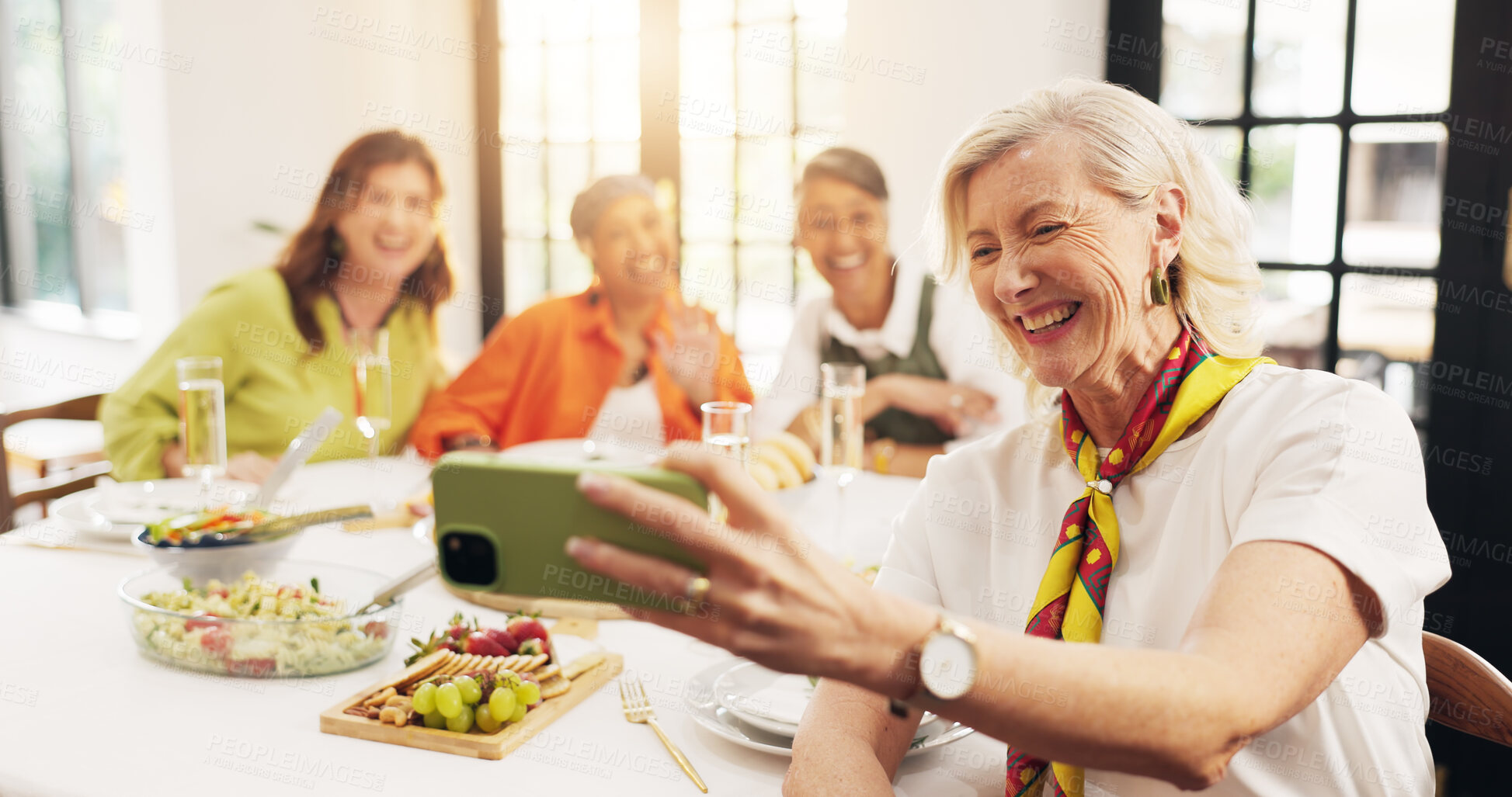 Buy stock photo Mature, happy women and dining table with selfie for feast, meal or social gathering in home. Group, female person or friends with smile, food or drinks for photography, picture or memory together