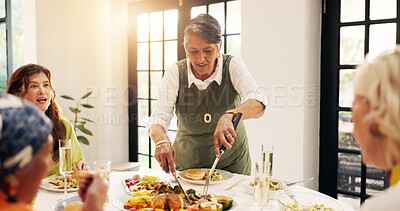 Buy stock photo Home, mature friends and serving lunch for thanksgiving celebration, holiday reunion and bonding. Festive feast, women and cut food at dining table for hosting brunch party, social gathering or event