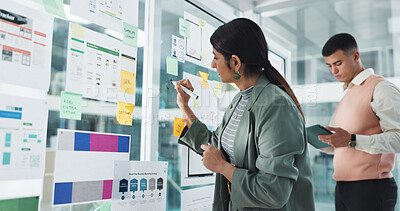 Buy stock photo Woman, writing and glass wall for app development, notes and team with documents, charts and review. People, board and tablet for brainstorming, software innovation and ux design at digital agency