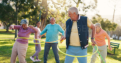 Buy stock photo Senior people, class and exercise with hoop at park for active retirement, wellness or laugh. Elderly friends, ring and fitness outdoor, funny joke or workout for balance with group for cardio health