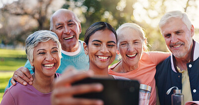 Buy stock photo Senior people, friends and selfie with personal trainer, hug and smile in park for summer and bonding. Mature group, men and women with embrace for fitness, profile picture and workout memory