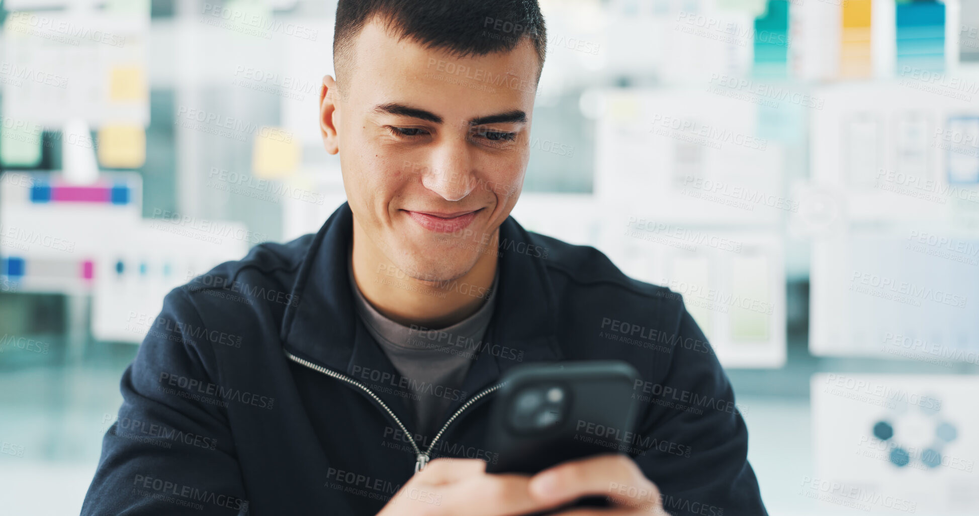 Buy stock photo Phone, happy and man in office with networking, communication or texting on mobile app for break. Smile, technology and male person with cellphone with chatting, email or social media in workplace.