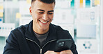 Phone, smile and man in office with networking, communication or texting on mobile app for break. Happy, technology and male person with cellphone with chatting, email or social media in workplace.