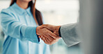 Shaking hands, interview and deal for hiring, recruitment process or agreement for job at company. Person, human resource manager and handshake for welcome, success or thanks for onboarding at agency