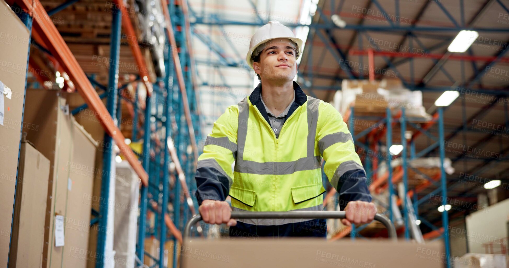 Buy stock photo Logistics, low angle or man in warehouse with trolley, shipment prep or inventory management in delivery. Distribution, ppe or loader in depot with box, dropshipping or export control in supply chain