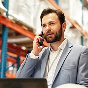 Supply chain, phone call and man in warehouse, distribution and ...