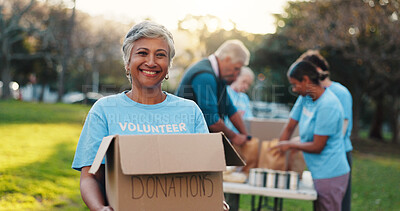 Buy stock photo Volunteer, park and portrait of woman with box for food drive, charity event and donation. Helping, teamwork and people with package for outreach program, community service and nonprofit outdoor