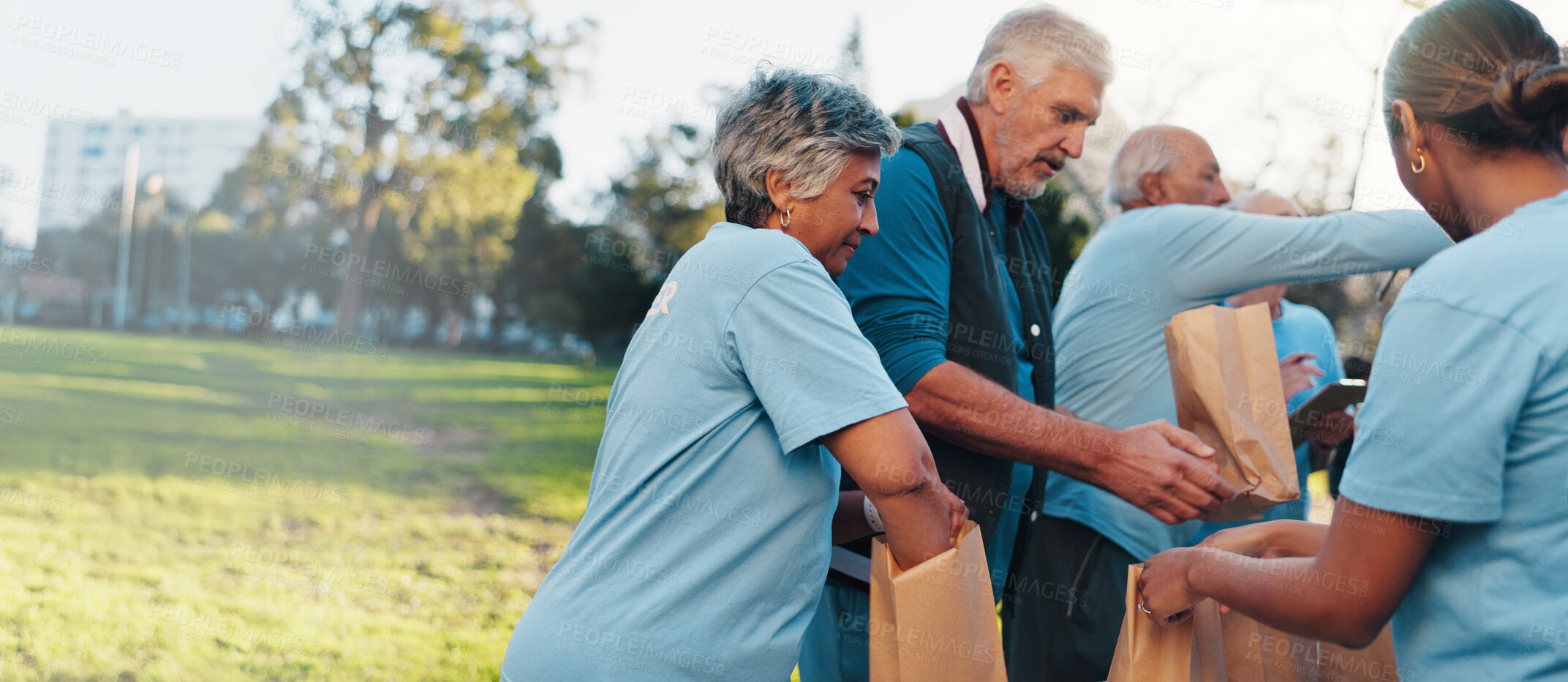Buy stock photo Volunteer, outdoor and senior people with packages for food drive, charity event and donation. Helping, teamwork and group with bags for outreach program, community service and nonprofit in park
