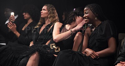 Buy stock photo Fashion show, gossip and people at runway event for branding, clothing collection or label launch. Laughing, talk and women with whisper for conversation at outfit showcase for designer at premiere.