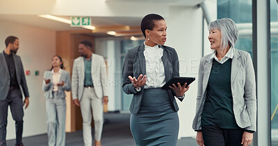 Buy stock photo Office, hallway and women with tablet, teamwork and criminal attorney with info for case or talking. Colleagues, research and lawyers with tech for legal evidence, discussion or plan for trial on web