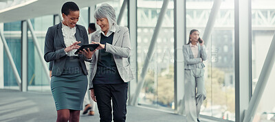 Buy stock photo Office, hallway and women with tablet, scroll and criminal attorney with info for case and teamwork. Reading, research and lawyers with tech for legal evidence, discussion and planning for trial