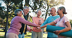 Senior people, hands together and huddle for motivation, solidarity or fitness support in outdoor park. Teamwork, mature group and friends for yoga collaboration, mission or workout for exercise