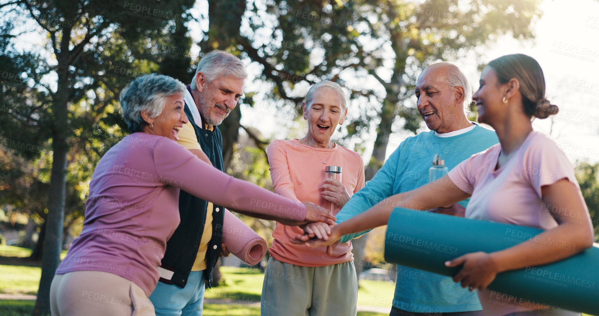 Buy stock photo Senior people, hands together and huddle for fitness, solidarity or motivation support in outdoor park. Teamwork, mature group and friends for yoga collaboration, mission or workout for exercise
