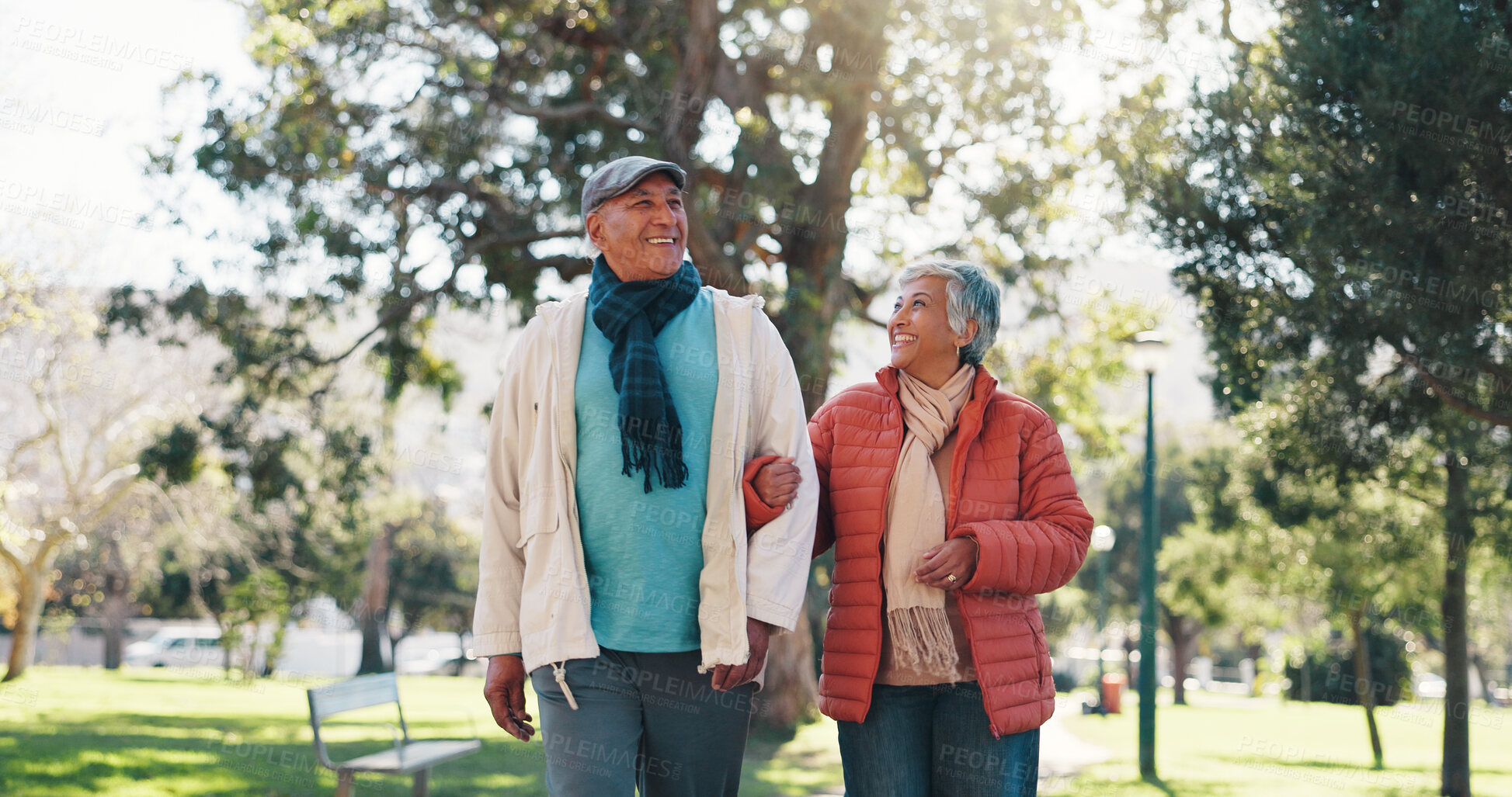Buy stock photo Retirement, walking and couple in park with bonding together, love and connection in happy marriage. Romance, old man or woman in nature with stroll, commitment or soulmate in healthy relationship.