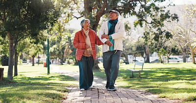 Buy stock photo Retirement, walk and couple in park with laugh, love and connection in healthy marriage. Romance, mature man and woman in nature with stroll, conversation and soulmate in happy relationship.