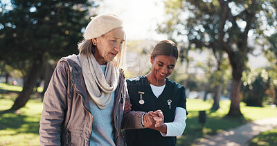 Buy stock photo Outdoor, caregiver and walking with senior woman, healthcare and support for rehabilitation or trust. Physical therapy, nurse and help for elderly patient with arthritis, health and people in nature