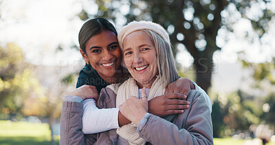 Buy stock photo Hug, portrait and smile of old woman with nurse in park for assisted living or rehabilitation. Love, support or wellness with happy caregiver and senior patient embracing in nature for retirement