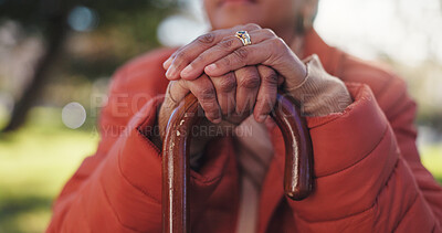Buy stock photo Balance, hands and walking stick with old person outdoor in park for retirement or wellness. Cane, equipment and senior with disability closeup in nature for arthritis, osteoporosis or support