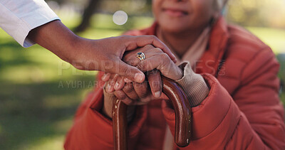 Buy stock photo Caregiver, hands together or old woman in park with walking stick, rehabilitation or support in retirement. Bokeh, parkinson or nurse in nature with cane, medical care or disability in outdoor stroll