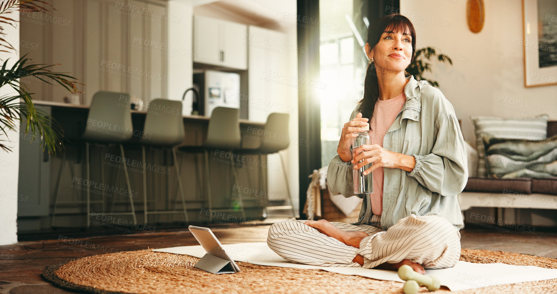 Buy stock photo Thinking, water bottle and yoga with woman on floor in living room of home for online holistic course. Drink, tablet and vision with mature yogi person in apartment for virtual health tutorial