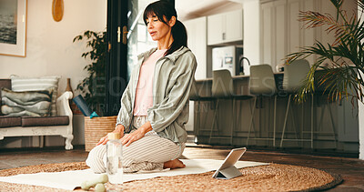 Buy stock photo Meditation, tablet and yoga with woman on floor in living room of home for online holistic course. App, balance and mindfulness with mature yogi person in apartment for virtual health tutorial