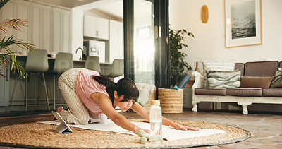 Buy stock photo Woman, yoga and stretching with tablet in home for online class, tutorial or fitness exercise. Active, female person or yogi with technology for child pose, virtual lesson or training in house