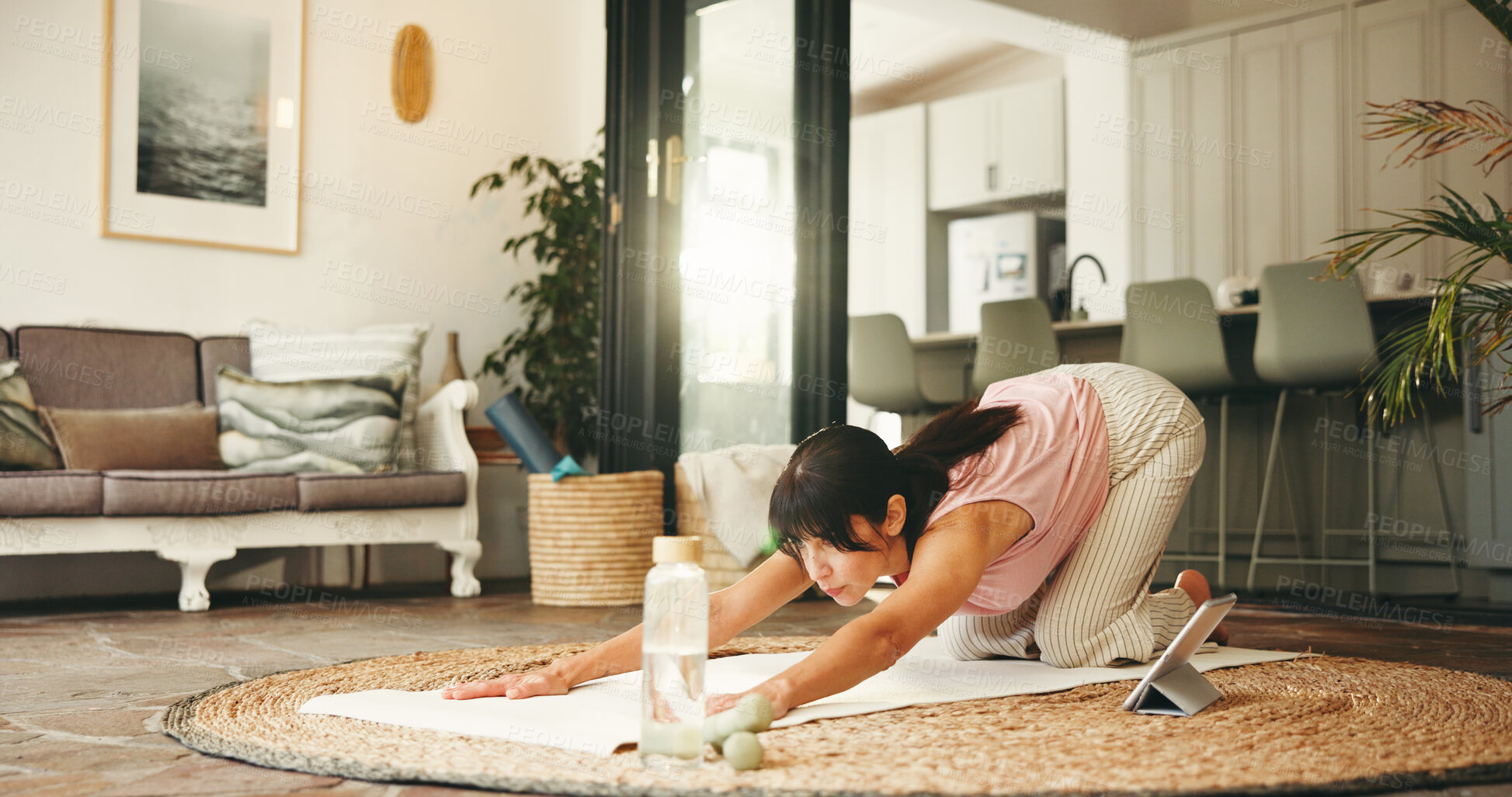 Buy stock photo Woman, yoga and stretching with tablet in home for tutorial, online class or fitness exercise. Active, female person or yogi with technology for flexibility, child pose or virtual lesson in house
